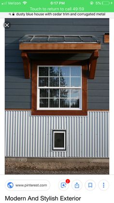 an image of a house with solar panels on the roof and windows in the wall