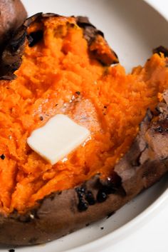 a white plate topped with sweet potatoes and mushrooms