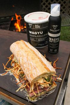 a sandwich sitting on top of a wooden table