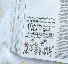 an open bible with flowers on it and the words, grass wishes from the lord