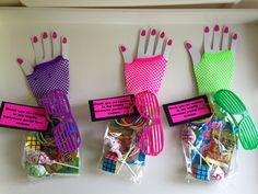 three bags of candy with different colored gloves on the top and one bag filled with gummy bears