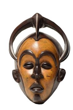 a wooden mask with horns on it's head