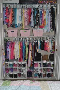 an organized closet with clothes and shoes