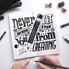 a person holding a pencil in front of an open book that says never anything you are from creating