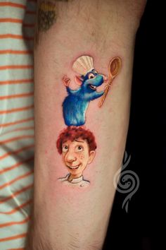 a cartoon character is on the arm of a man