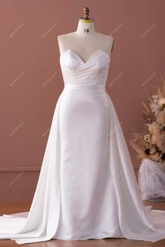 Plus Size Strapless Detachable Overskirt Satin Timeless Wedding Dress #weddingdress #bridaldress #designerweddingdress #springweddingdress #fallweddingdress #autumnweddingdress #winterweddingdress #plussizebridaldress #plussizeweddingdress Formal Gowns Elegant, Satin Mermaid Wedding Dress, Plus Size Bridal Dresses, Timeless Wedding Dress, Spring Wedding Dress, Duchess Satin, Fit And Flare Skirt, Designer Bridal Gowns, Custom Wedding Dress