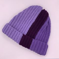 Shades of lavender and plum in vertical stripes circle this cozy, comfy beanie.  Made from 100% acrylic, worsted weight yarn.  Handmade crochet. *Design is NOT slouchy, made to fit on the head without extra room. Approx 8.5" from top of hat to bottom of folded brim. ONE SIZE - should fit child L or adult XS/S/M Purple Crochet Yarn Hat, Hand Knitted Purple Crochet Hat One Size Fits Most, Purple Crochet Hat One Size Fits All, Hand Knitted Purple Yarn Hats, Hand Knitted Purple Crochet Hat One Size, Purple Crochet Hat One Size, Purple Hand Knitted Crochet Hat, Purple Hand Knitted Crochet Cap, Purple Hand-knitted Crochet Cap