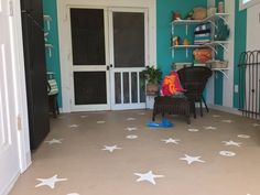 a room with blue walls and white stars on the floor