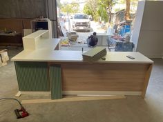 an office counter is being built in a garage