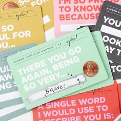 there are many different types of cards with words on them and one has a penny in it