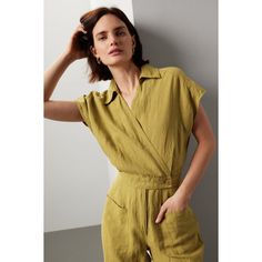 Green linen (100% Linen). Jumpsuit. Cap sleeves. Collared. Front button closure. 17" from shoulder to hemline. 27" inseam. 14" rise. Imported. Chic Linen Jumpsuits And Rompers With Short Sleeves, Relaxed Fit Linen Short-sleeved Jumpsuit, Relaxed Fit Linen Jumpsuit With Short Sleeves, Relaxed Fit Linen Jumpsuits And Rompers With Short Sleeves, Spring Linen Jumpsuits And Rompers For Work, Fitted Linen Jumpsuits And Rompers With Pockets, Spring Fitted Linen Jumpsuits And Rompers, Fitted Linen Jumpsuits And Rompers For Spring, Casual Linen Jumpsuits And Rompers For Work