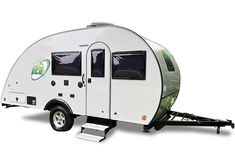 a white trailer with a green logo on the front and side door is parked against a white background