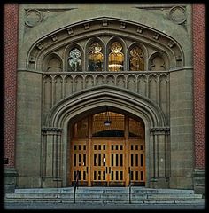 an old building with a large wooden door