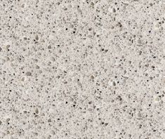 the texture of concrete is white with black dots and small rocks on it's surface