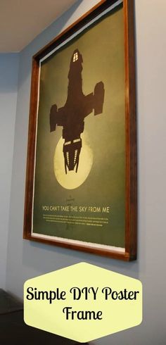 a poster hanging on the wall next to a window with an image of a fighter jet