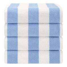 three blue and white striped towels stacked on top of each other in front of a white background