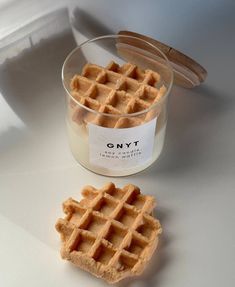 two waffles sitting next to each other in a glass container on a table