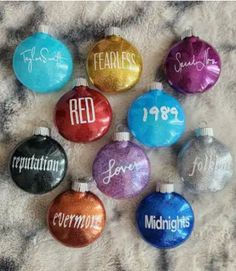 six personalized christmas ornaments with names and dates on them, all in different colors