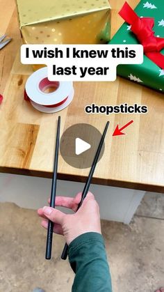 someone is holding chopsticks in their hand with the words i wish i knew this last year