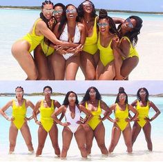 several women in yellow swimsuits posing for pictures on the beach, one is wearing sunglasses