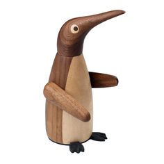 a wooden toy penguin standing on its hind legs