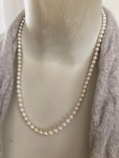 "Beautiful lustrous vintage akoya cream pearl necklace with 14k gold clasp. 20\", 5-5.75 mm pearls. Pretty cream with pink color, thick nacre, and smooth skins. Nice dainty classic pearl necklace that comes in a cream suede drawstring pouch." Elegant Single Strand Cream Pearl Necklace, Elegant Cream Single Strand Pearl Necklace, Classic Round Hypoallergenic Necklace, Classic Cream Necklace With Pearl Chain, Classic Cream Pearl Necklace With Pearl Charm, Classic Cream Pearl Chain Necklace, Classic Single Strand Pearl Necklace, Classic Single Strand Round Pearl Necklace, Classic Cream Pearl Jewelry