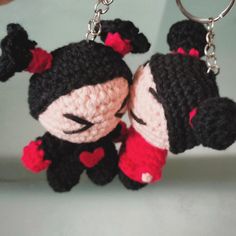 two crocheted keychains that are shaped like cartoon characters