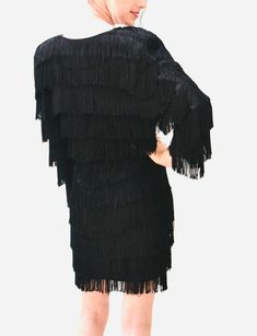 "super fun 80s does 20's inspired fringe dress: * Constructed in black knit jersey for comfy fit * Fringe on the whole body * Elbow Length sleeves * Structured padded shoulders * Used vintage condition, the fringe is frayed on some ends and has been cleaned. By CM Larfra NYC couture No Size, like a Small Medium 100% polyester jersey (With a bit fo stretch) Bust 33-40\" Hips 36-44\" Length from high point of shoulder 34\" All measurements are given in full. Thank you for visiting Hooked On Honey, Black Beaded Fringe Flapper Dress, Black Flapper Dress For Cocktail Events, Black Cocktail Flapper Dress, Black Flapper Dress For Costume Party, Black Flapper Dress For Party, Flapper Dress With Fringe For Party, Black Fringe Mini Dress For Party Season, Black Mini Dress With Tassels For Party, Black Tassel Mini Dress For Party