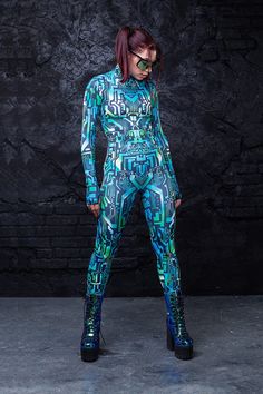 For all the babes with sparks in their eyes and voltage running through their veins. Electrify the dance floor with our Short Circuit Costume. This piece is made from a high quality stretchy and breathable Lycra fabric, that feels wonderful on the skin. It’s printed with outstanding graphics that react to UV light, so you can literally glow. The design features long sleeves with thumbholes, a mock neckline and a body con fit. Rock it on Halloween Eve or ur next festival of choice. U won’t go unn High Stretch Elastane Unitard For Party, High-stretch Elastane Unitard For Party, Fitted Rave Unitard For Cosplay, Rave Unitard With Stretch For Festivals, Rave Stretch Unitard For Festivals, Rave Unitard With Stretch Fit For Festivals, Rave Style Stretch Unitard For Festivals, Fitted Elastane Unitard For Sports, Fitted Rave Unitard For Festivals