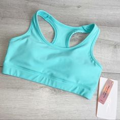 New Gottex Peach Skin Sports Bra Balmy Blue Light Aqua Racerback Size Options: Xs Or S Original $52 Price Tags Attached A Classic Active Wear Bralette For Everyday Wear. Peach Skin Collection Color: Balmy Blue (Aqua) Style Xgt-Bh2025b 11" Length (S) Scoop Neck Halter/Racer Back Removable Light Padding Moisture Wicking, Quick Drying, 4 Way Stretch, Flat Lock Stitch Supportive Blue Sports Bra With Built-in Padding, Blue Sports Bra With Built-in Bra For Light Exercise, Summer Breathable Blue Sports Bra, Blue Snug Fit Sporty Activewear, Sporty Snug Fit Blue Activewear, Blue Fitted Sports Bra For Light Exercise, Blue Stretch Basic Activewear, Basic Blue Stretch Activewear, Casual Blue Sports Bra With Built-in Padding