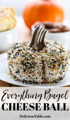 everything bagel cheese ball on a white plate