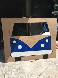 the cardboard bus is painted blue and white