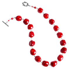 Beautiful coral (color enhanced) beaded necklace with a decorative marcasite and sterling silver toggle clasp. Stones: Bamboo Coral (color enhanced), Marcasite Dimensions: Approx. 20" long Material: .925 Silver Made in: USA