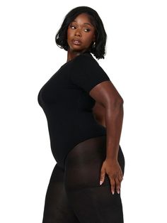 This bodysuit features a crew neckline and short sleeves that resembles a T. Features our signature double-lined fabric with stretch and comfort. Thong cut at the back with snap closures down below. NW Collection Import 95% Viscose, 5% Spandex Model wears size 1X True to size This body is double-lined All Bodysuits Are Final Sale Fitted Black Short Sleeve Bodysuit With Crew Neck, Fitted Black Crew Neck Short Sleeve Bodysuit, Black Fitted Short Sleeve Crew Neck Bodysuit, Black Fitted Crew Neck Short Sleeve Bodysuit, Black Stretch Short Sleeve Bodysuit, Black Scoop Neck Short Sleeve Bodysuit, Fitted Black Short Sleeve Bodysuit, Black Stretch Smoothing Bodysuit, Black Short Sleeve Bodysuit With Scoop Neck For Summer