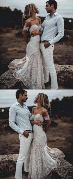 two people standing next to each other in front of the ocean and one person wearing white