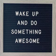 a black and white sign that says wake up and do something awesome on the wall