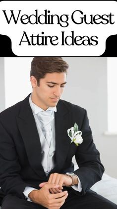 Stylish wedding guest attire showcasing a man in a classic black suit, white vest, and boutonniere, adjusting his watch in a formal and elegant setting.