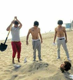 three young men standing on top of a sandy beach next to each other with the words one direction above them