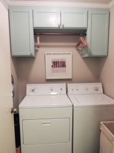 a washer and dryer in a small room