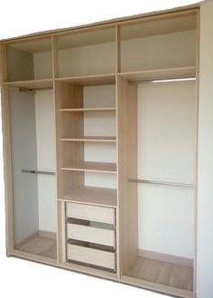 an empty walk in closet with wooden shelves and drawers