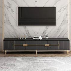 a living room scene with focus on the entertainment unit and marble wall behind it,