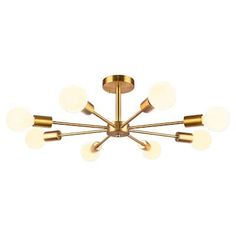 a brass chandelier with five lights on each side and four balls hanging from the ceiling