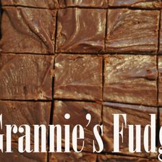 a close up of some brownies in a pan with the words grammie's fudge on it