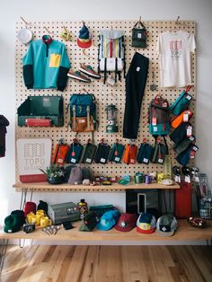 a peg board with many items hanging on it