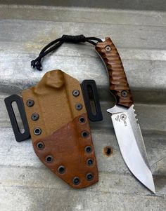 a knife and sheath sitting on some steps