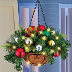 a hanging basket filled with christmas ornaments