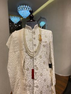 This comes with sherwani, pant/pajama, sherwani necklace and sherwani shawl. For any assistance or query whatsapp us at +91-9079290206. Traditional Kundan Sherwani For Ceremonial Occasions, Traditional Kundan Sherwani For Festive Occasions, Ceremonial Sherwani With Naqshi For Diwali, Bollywood Style Ceremonial Sherwani With Naqshi, Bollywood Style Kundan Sherwani For Ceremonial Occasions, Ceremonial Bollywood Sherwani With Naqshi, Ceremonial Kundan Sherwani For Festive Occasions, Ceremonial Bollywood Sherwani With Kundan, Bollywood Style Sherwani With Naqshi For Ceremonial Occasions