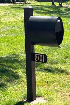 a mailbox in the middle of a grassy field