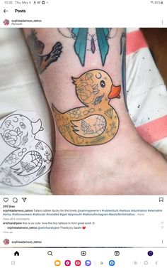 a person with a tattoo on their foot that has a rubber ducky in it