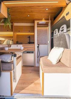 the interior of an rv with wood paneling